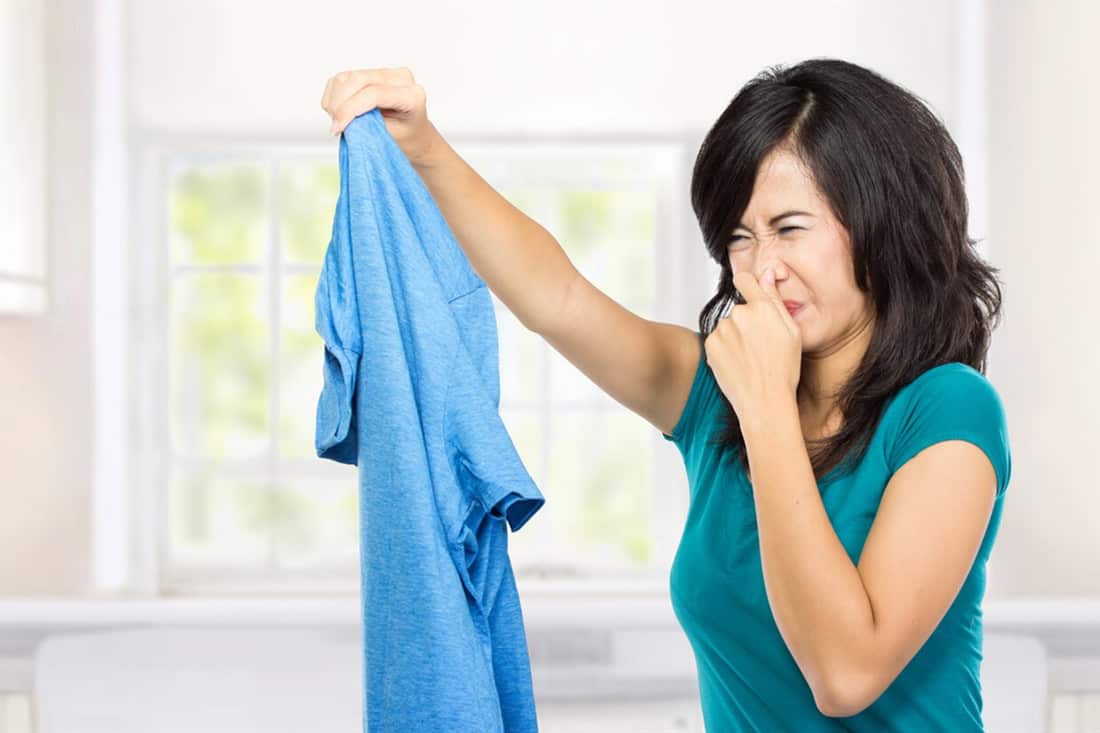how to get the sour smell out of clothes