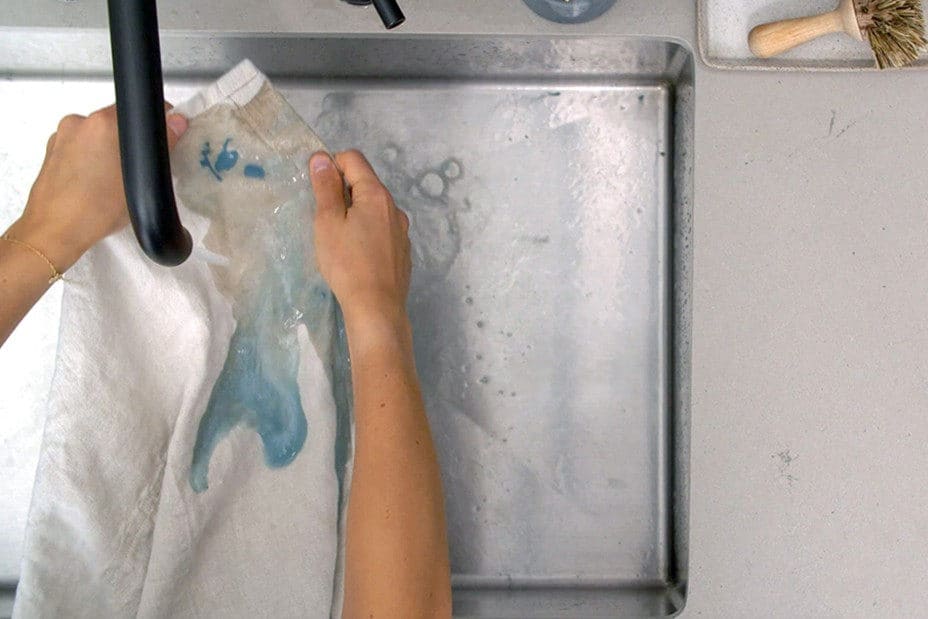 How to get water based paint out of clothes