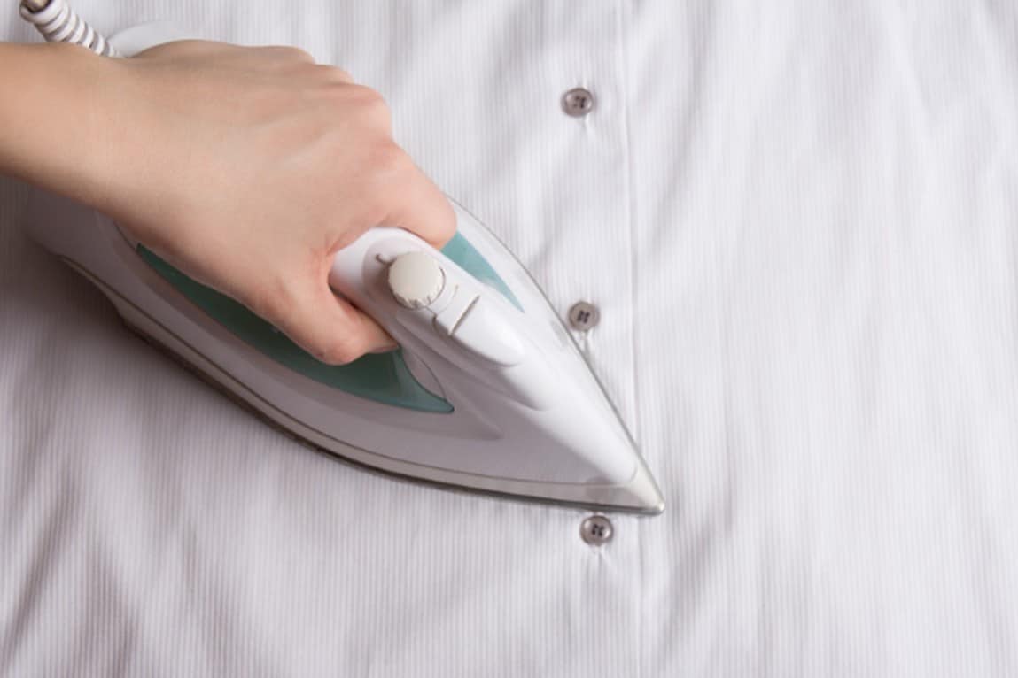 How to iron areas around buttons